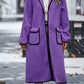 Fashionable long sherpa coat in purple, perfect for adding a pop of color.
