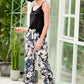Elevate your loungewear with our chic Lace Trim Cami & Floral Pants Set - perfect for relaxed days in or stylish outings.