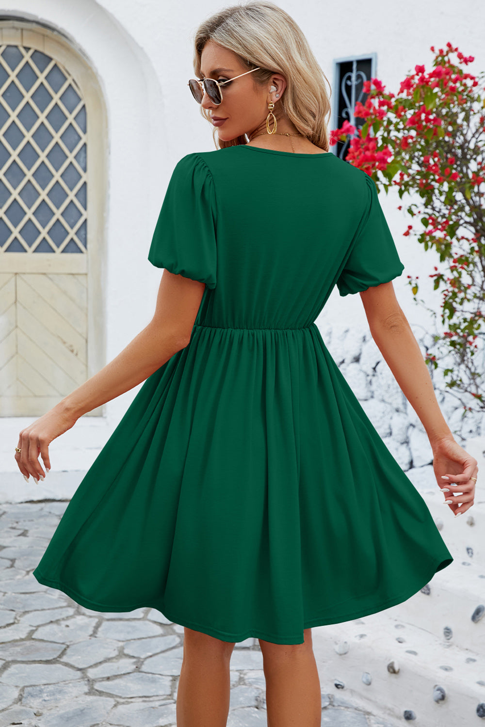 Green short-sleeve dress with a gathered waist.