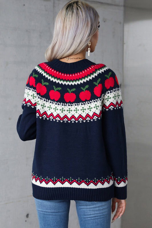 Playful apple Fair Isle knit sweater styled with jeans for a festive look