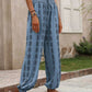 Blue drawstring pants featuring a stylish bohemian print