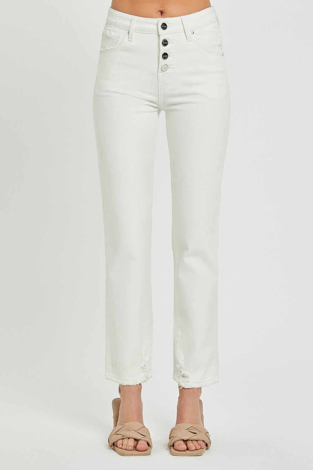 Mid-rise white jeans with a stylish button-fly front by RISEN.