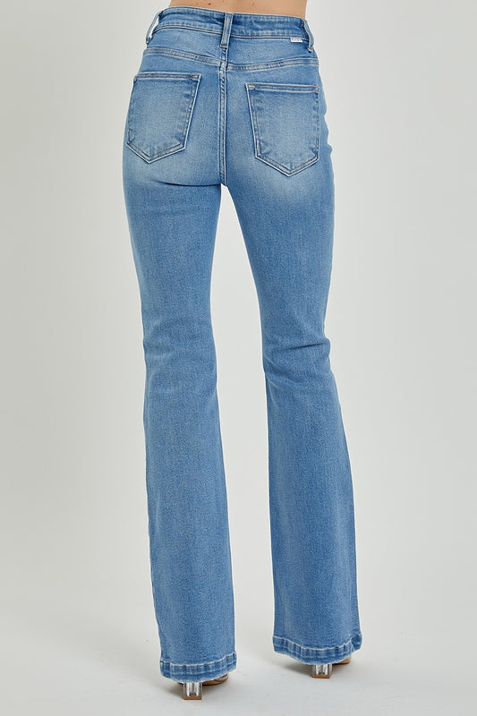 RISEN high-rise jeans showcasing a timeless light-wash finish.
