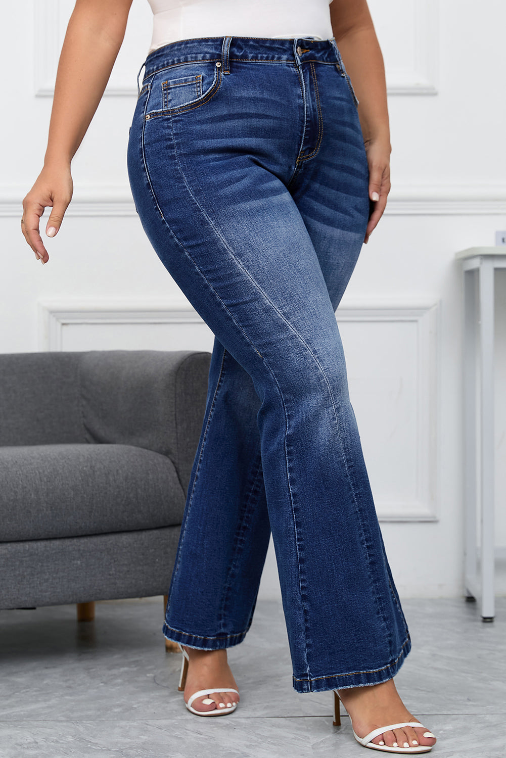 Women's plus size vintage washed flare jeans with a flattering fit.
