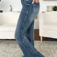 Women's flare jeans with high waist and tummy control for a flattering fit.
