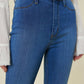 Front view of high-rise flare jeans with button closure.
