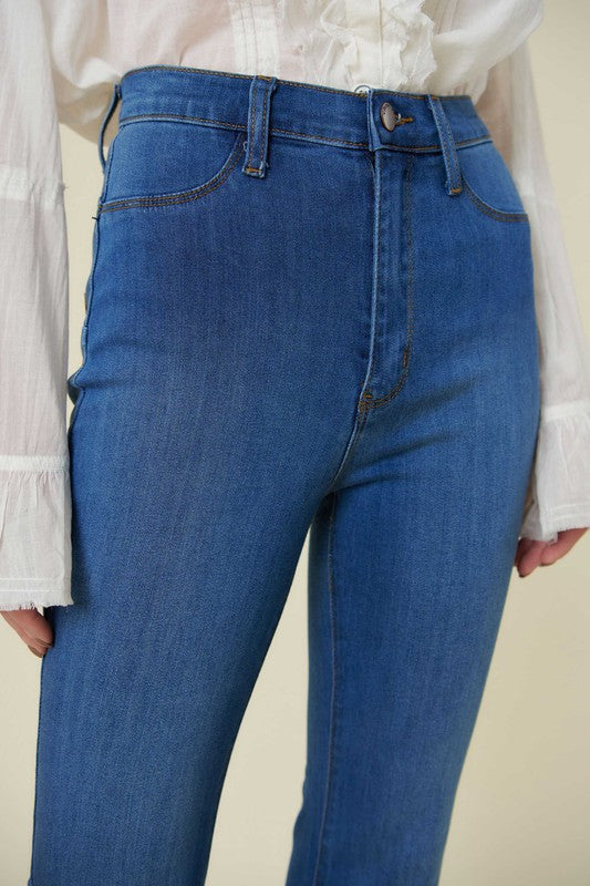 Front view of high-rise flare jeans with button closure.
