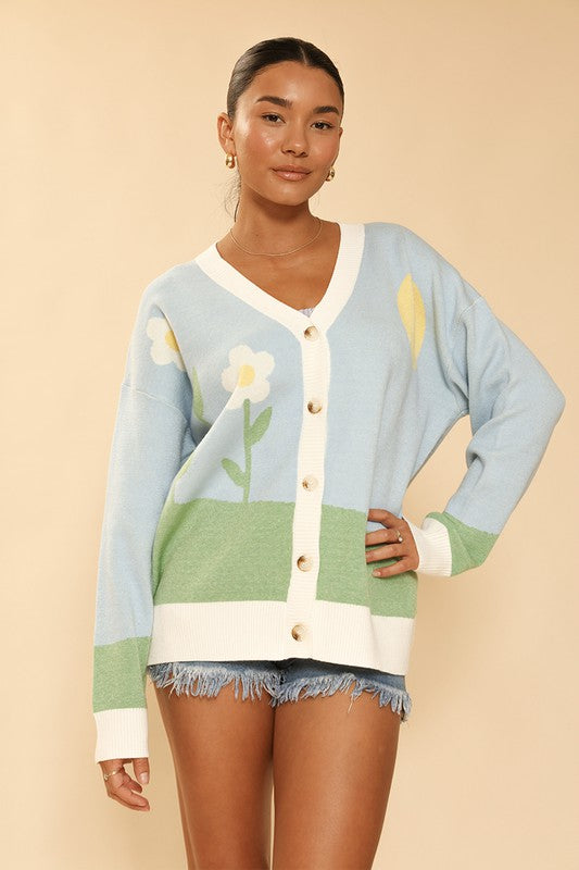 Floral Garden Button-Down Cardigan in light blue and green, with a playful floral pattern.