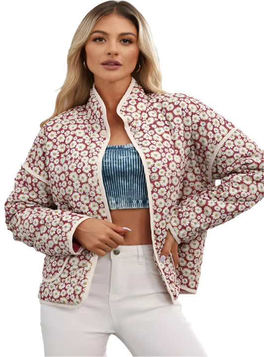 Woman wearing a Floral Snap-Down Mock Neck Coat with daisy print.
