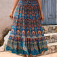 Full-length image of a flowy blue boho maxi skirt with vibrant patterns.
