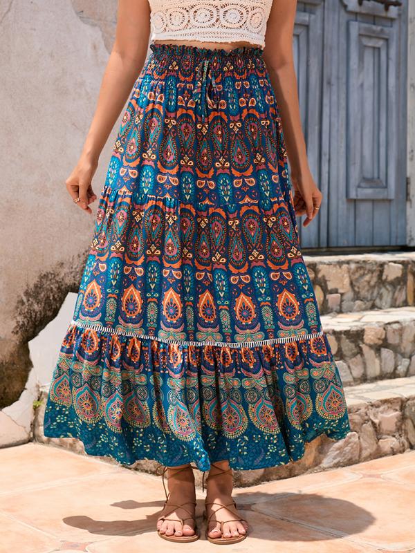 Full-length image of a flowy blue boho maxi skirt with vibrant patterns.
