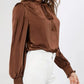 Silky brown lantern sleeve blouse with delicate frill detailing.
