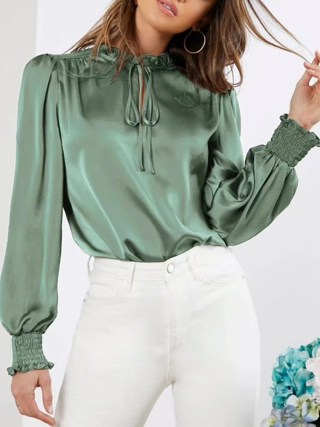 Flowy green lantern sleeve blouse with romantic frill details.
