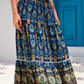 Flowing navy patchwork maxi skirt with a flattering A-line silhouette.
