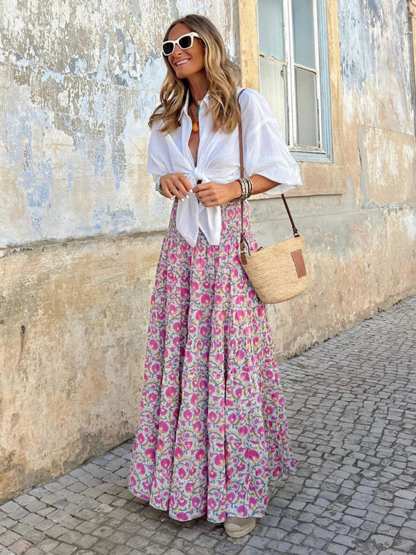 Flowy pink boho maxi skirt styled for casual summer outings or vacations.
