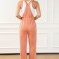 Peach-colored drawstring waist overalls paired with heels for an elevated casual look.
