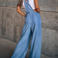 Trendy wide-leg denim overalls in light wash for women’s casual style.
