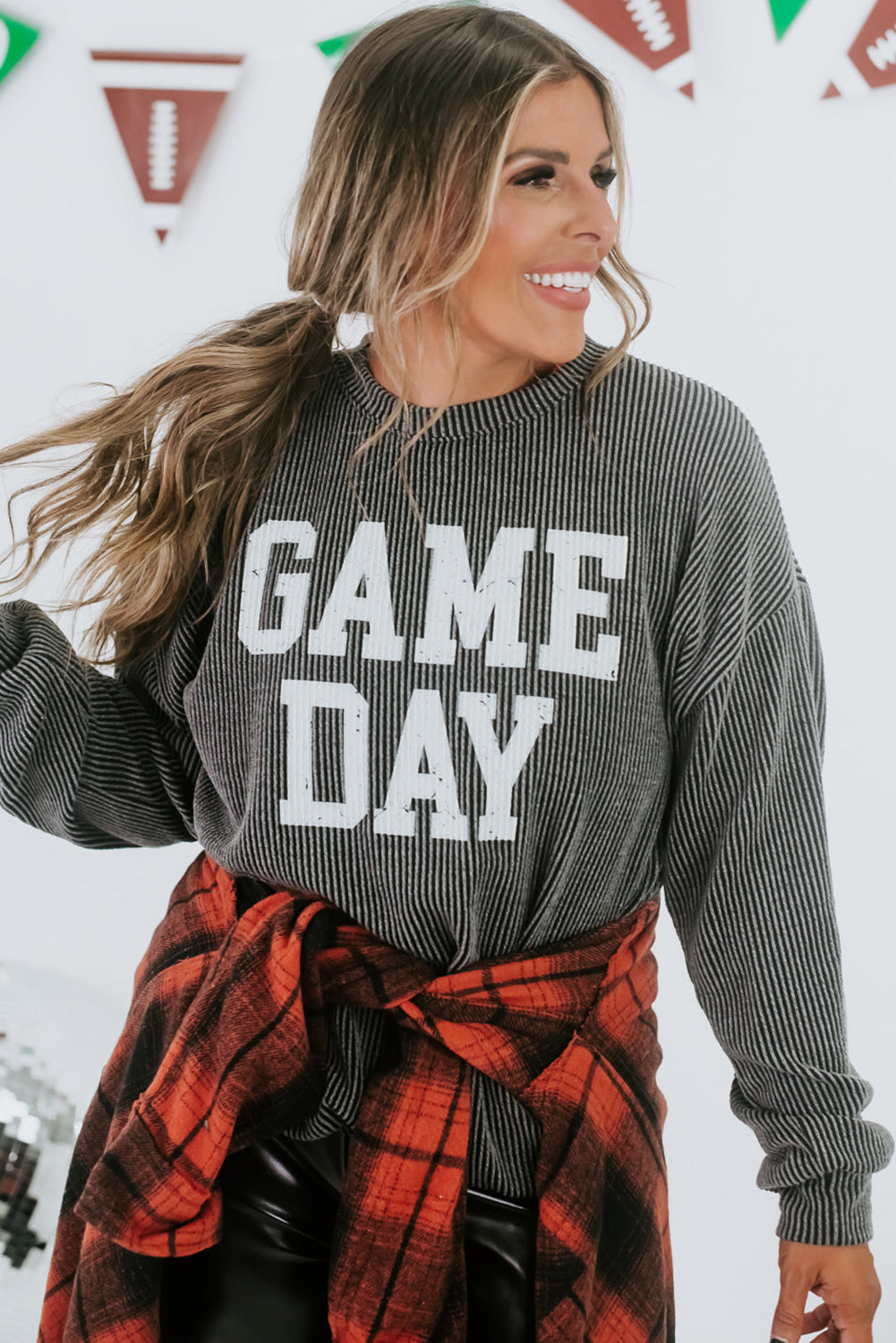 Comfy and stylish women's game day sweatshirt with bold white "Game Day" graphic.