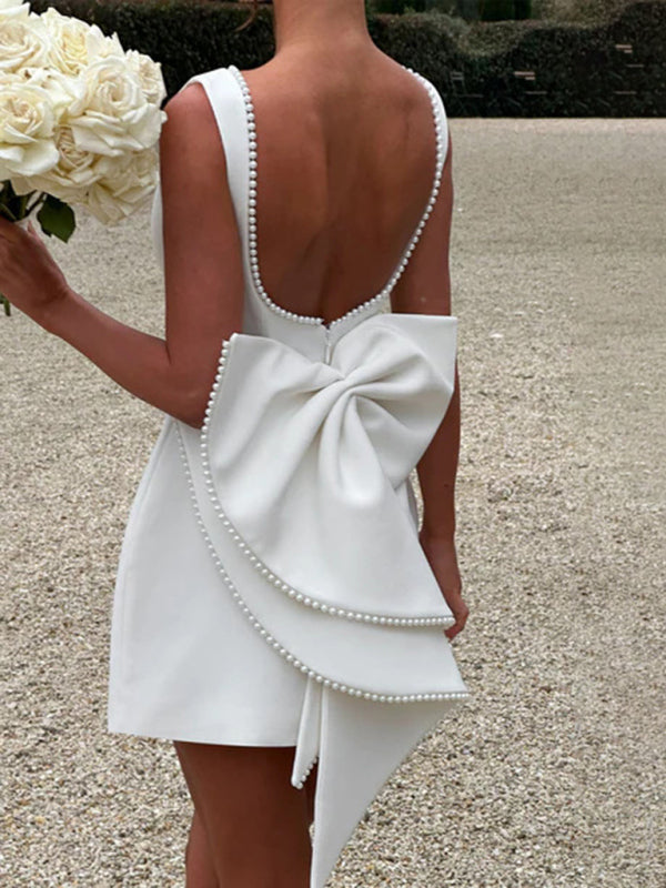 Beautiful white dress for special occasions with pearl trim

