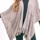 Gray fringe hem knit shawl paired with a simple outfit.
