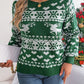 Full-length view of the green reindeer snowflake sweater, ideal for pairing with jeans for a winter look.