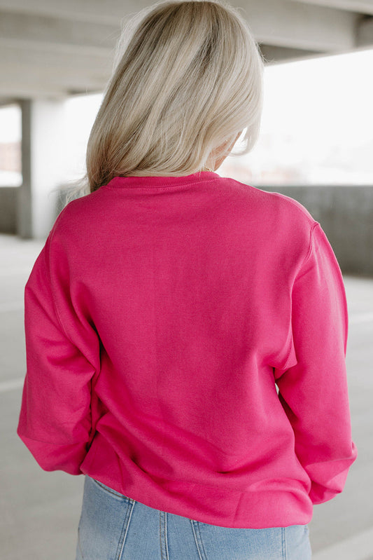 Bright pink cow-themed sweatshirt with relaxed fit for casual wear
