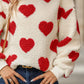 Red fuzzy heart sweatshirt worn casually for a warm, cozy look