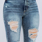 Full-length bell bottom jeans in blue denim with edgy ripped accents.
