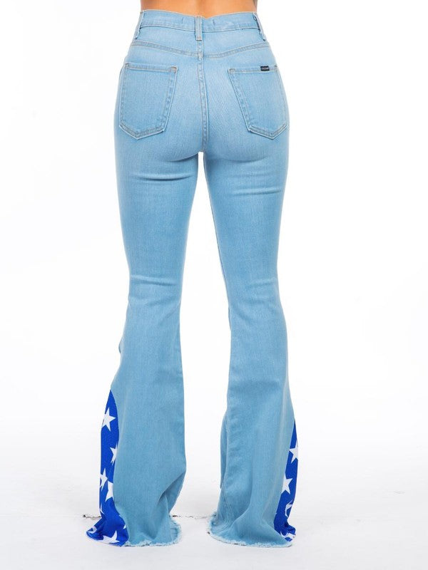 Back view of GJG Denim Star Bell Bottom Jeans highlighting the frayed hem and back pockets.
