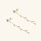 Gold-plated leaf earrings with sparkling moissanite
