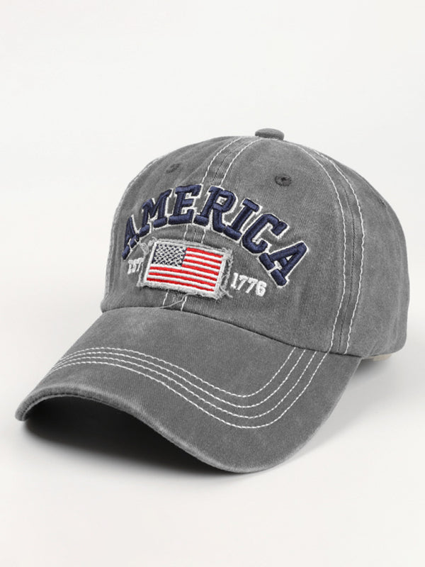 Front view of a gray embroidered American flag denim baseball hat.
