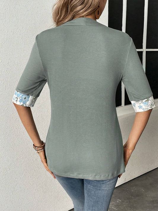 Gray half-sleeve top with floral print sleeves and a matching underlayer