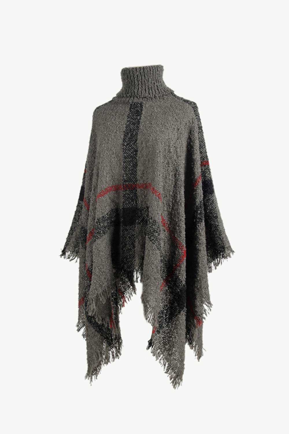 Gray turtleneck poncho with classic plaid print and fringe.
