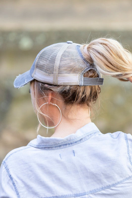 Gray messy bun hat with adjustable fit
