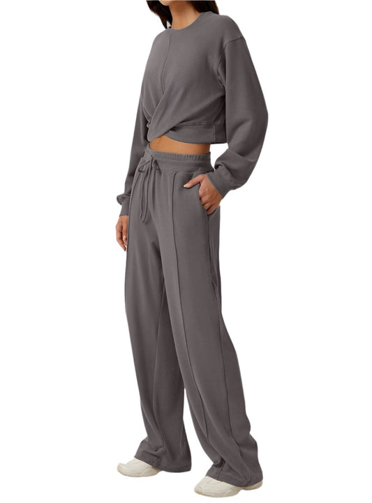 Gray cropped twist-front sweatshirt and wide-leg pants two-piece set.
