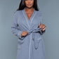 Front view of a gray waffle robe with a belted waist and patch pockets, perfect for relaxing at home.
