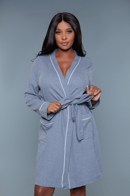 Front view of a gray waffle robe with a belted waist and patch pockets, perfect for relaxing at home.
