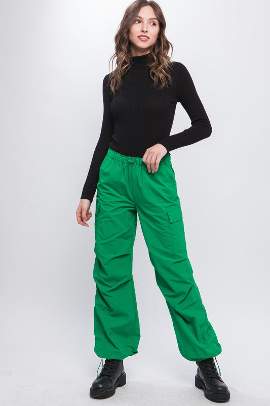 Green cargo pants styled casually with a relaxed fit for everyday wear.
