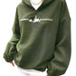 Woman wearing a green "Climbing Mountain" fleece pullover.
