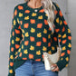 Front view of the green fall leaf print sweater, perfect for cozy autumn days.