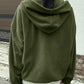 Woman in a green fleece pullover, ideal for casual outings.
