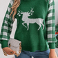 Full-length view of a green knit sweater with a white reindeer graphic and plaid sleeves, ideal for winter wear.