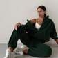 Green hooded leisure sweater set featuring a relaxed fit and casual style.
