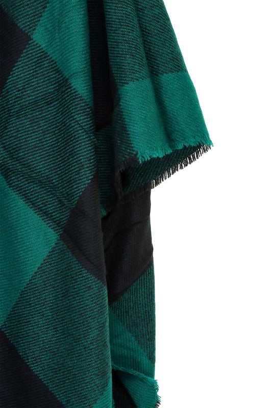 Stylish green plaid poncho with boho-inspired fringe
