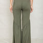 Trendy green ruffle hem pants with a playful, feminine hem
