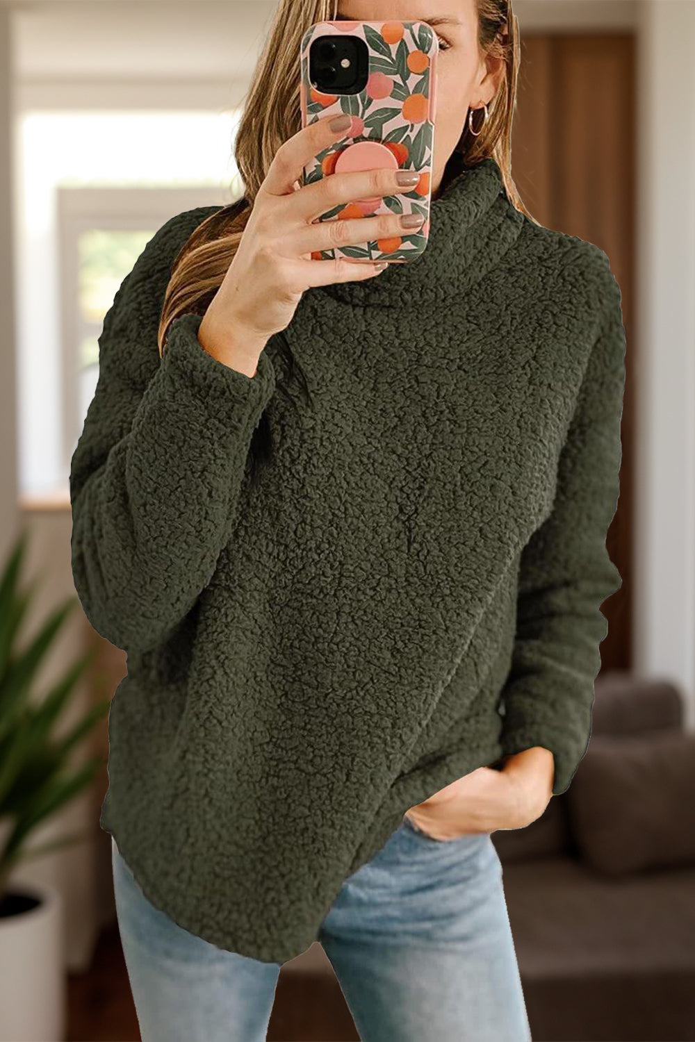 green sherpa fleece pullover with a high neck and cozy fit
