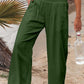 Green smocked waist wide leg pants with pockets
