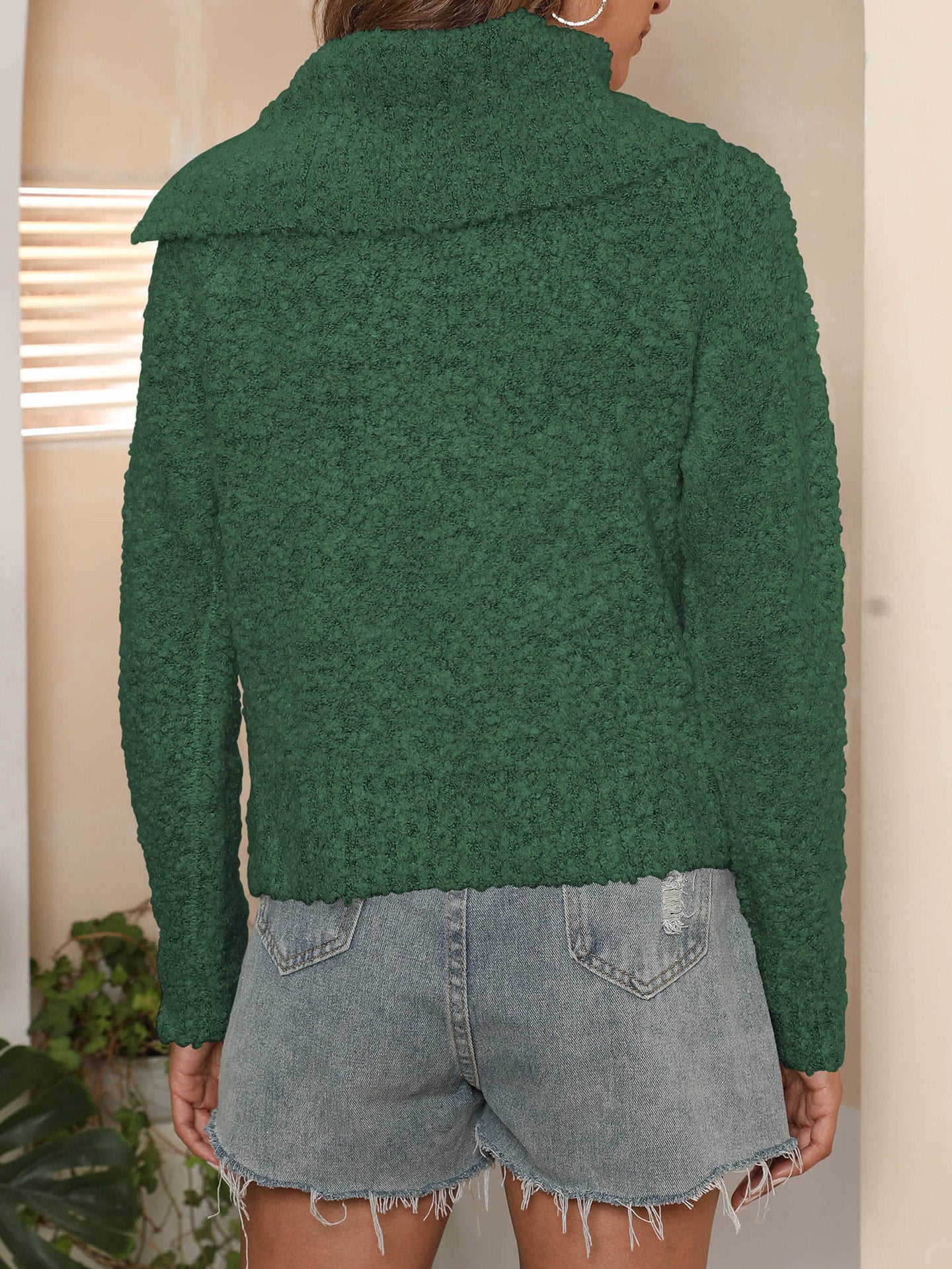 A casual outfit styled with the green textured knit sweater, ideal for a laid-back fall look.

