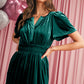 Tiered green velvet dress offering a flowy fit and functional pockets
