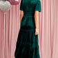 Back view of green velvet tiered maxi dress featuring elegant short sleeves
